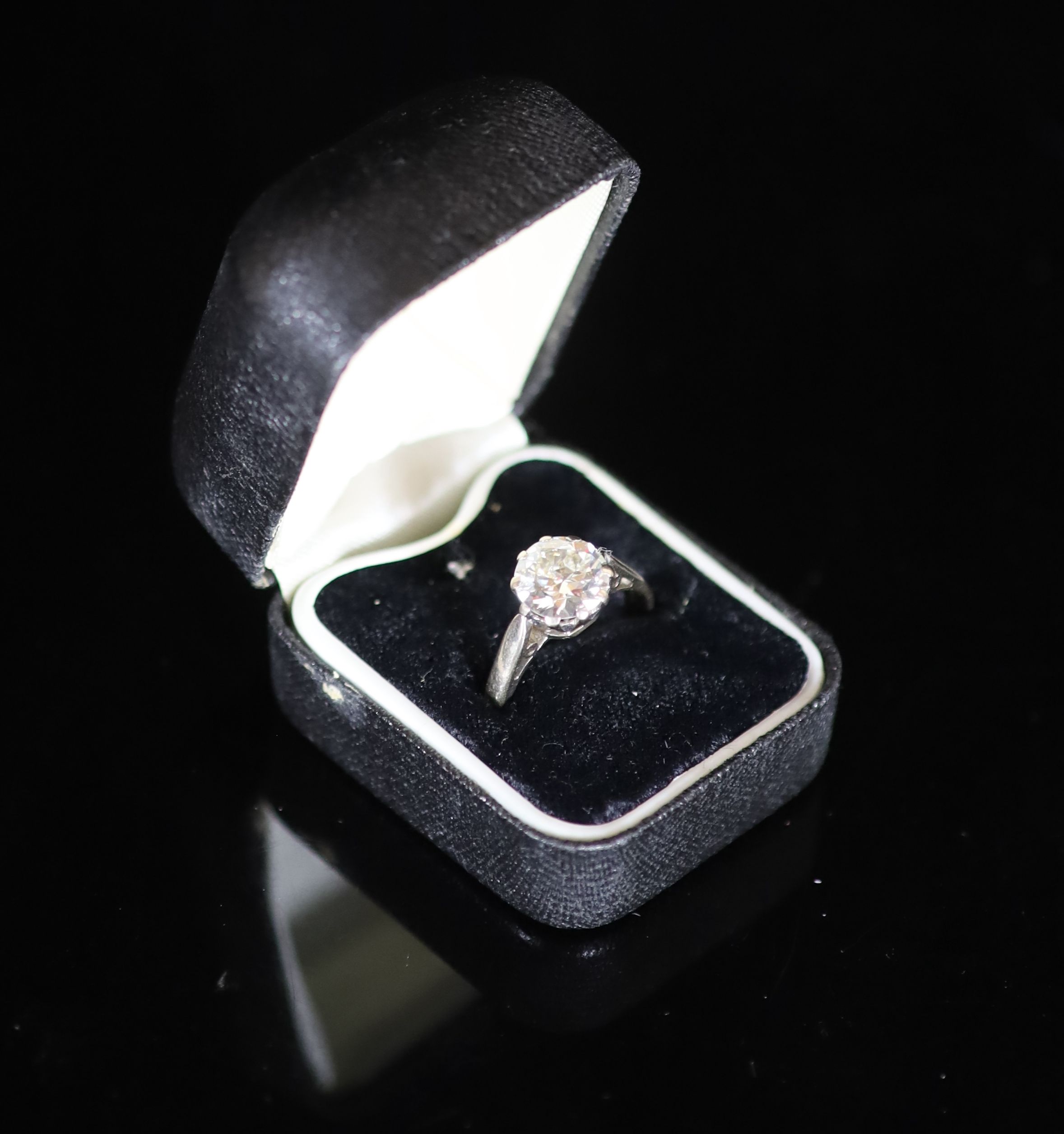 A modern 18ct white gold and solitaire diamond ring